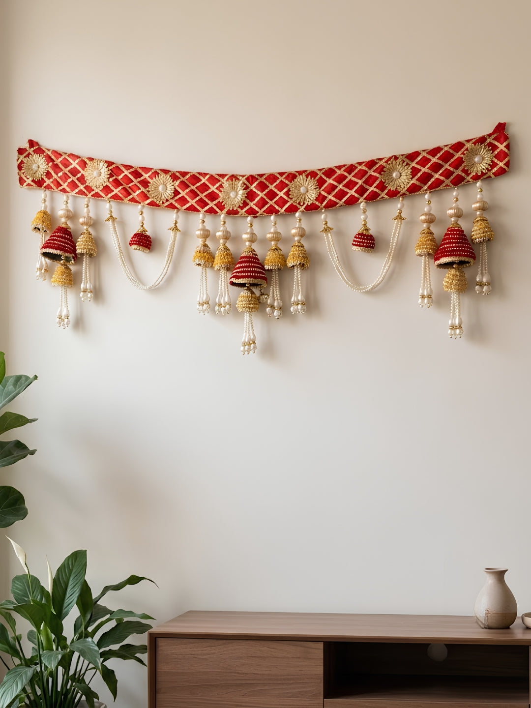red gota cloth top with yellow & red gota cone hanging toran