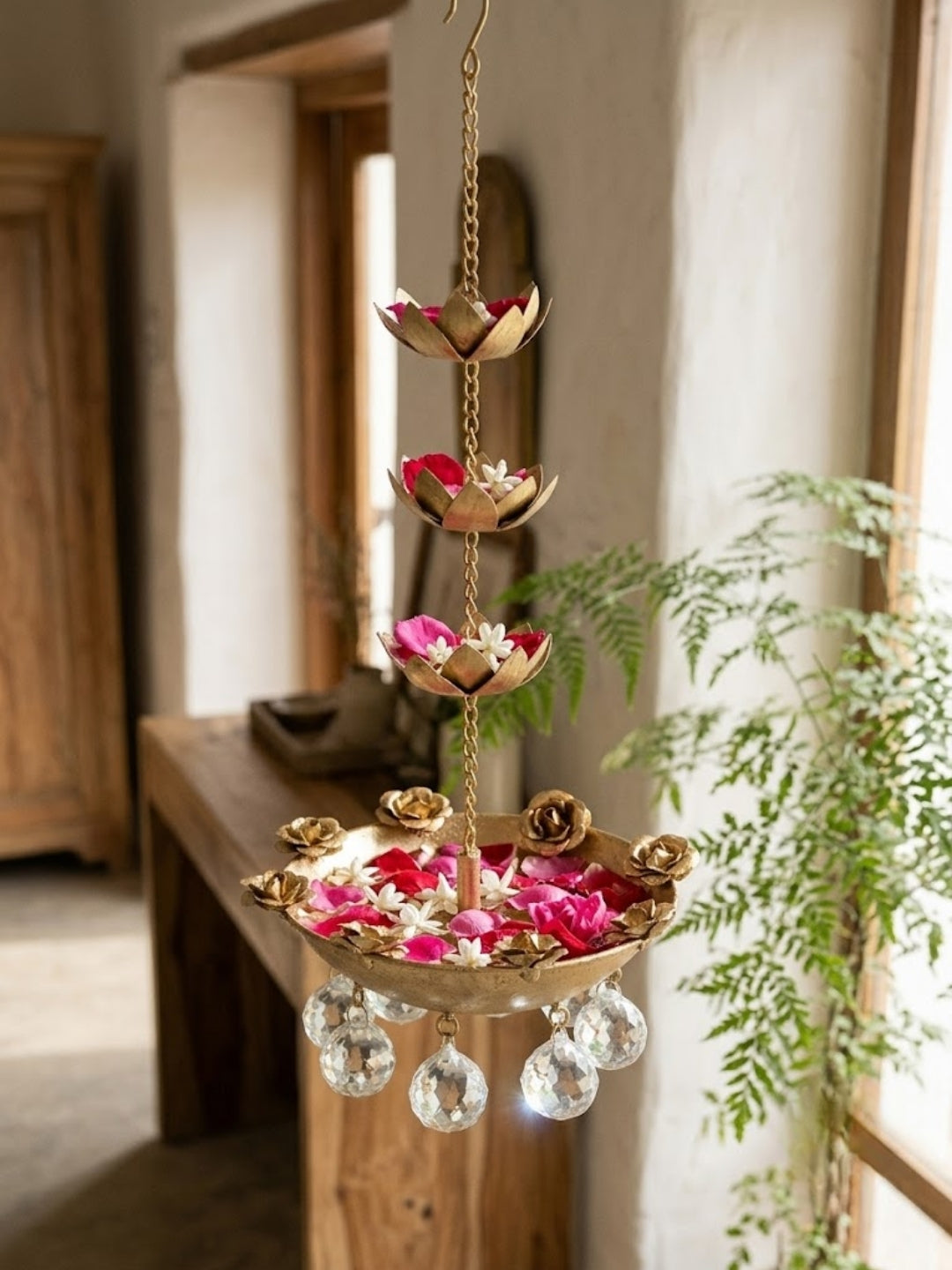 Metal gold finish hanging urli with crystal drops