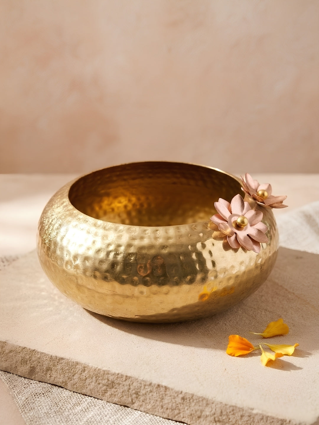 Metal gold colour hammered urli with 2 metal flowers decor