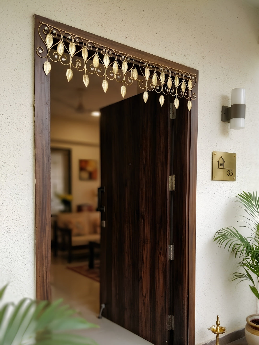 metal gold finish paisley toran with leaf